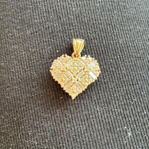 14k Gold heart pendant. Cz or diamond gems.